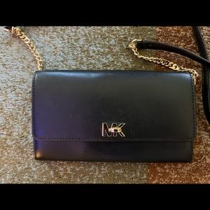Michael Kors black clutch in mint condition.